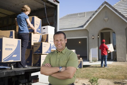 Packing and loading household items into a removal van