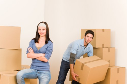 Local moving specialists in Croydon loading furniture into a vehicle