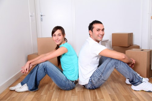 Local movers handling boxes and furniture near Croydon flats
