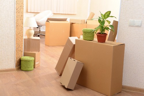 Removal team carrying furniture during a flat move in Croydon